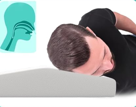 Man sleeping on Pyramid Pillow with head tilted, inset showing clear airway and tongue positioned to prevent snoring